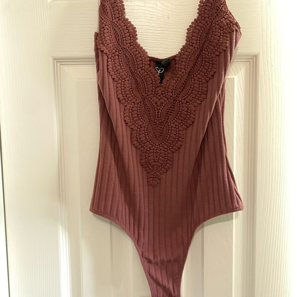 Body suit bottom buttons